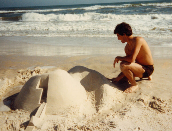 The author playing in the sand at the age of 16.
